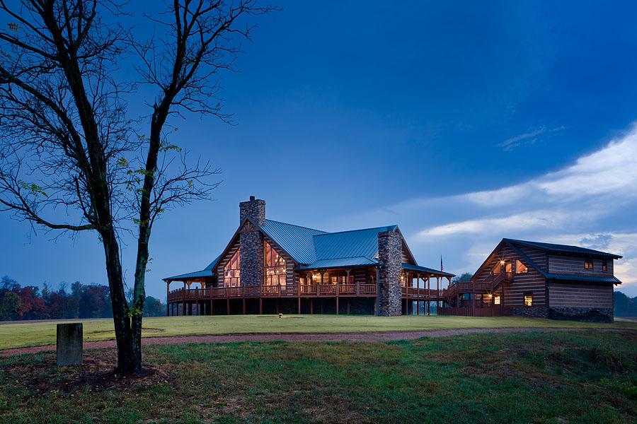 Exterior, horizontal, rear 3/4 view at twilight with house and garage with bonus room,